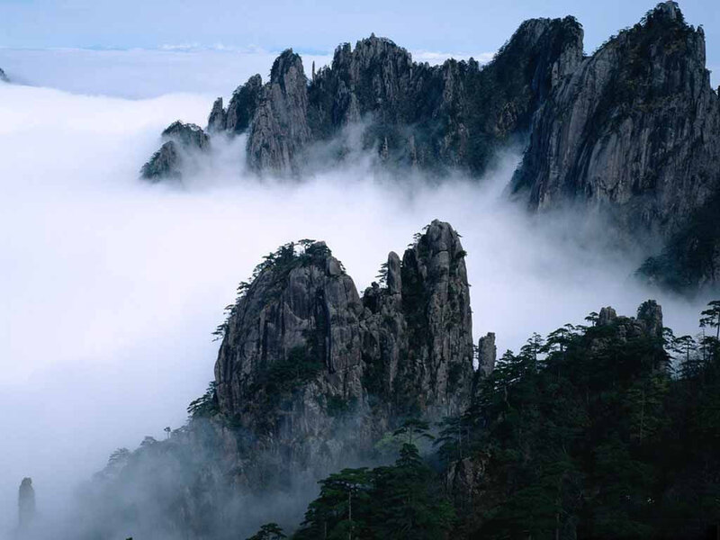 Mountain Peaks Above Clouds — Gray