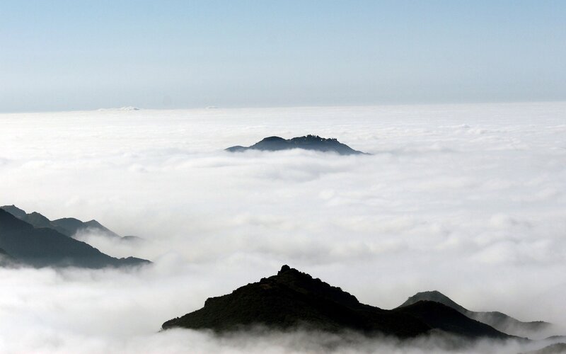 Mountain Peaks Above Clouds — Morning