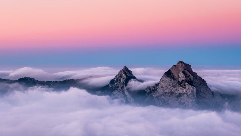 Mountain Peaks Above Clouds — Pink, Serene