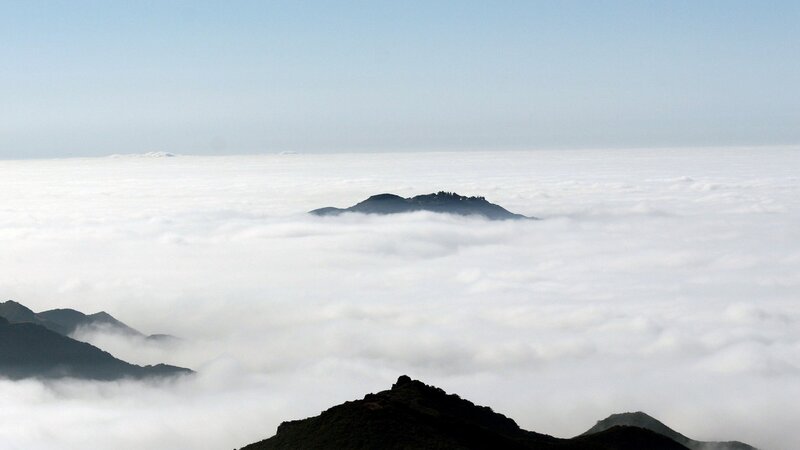 Mountain Peaks Above Clouds — Serene
