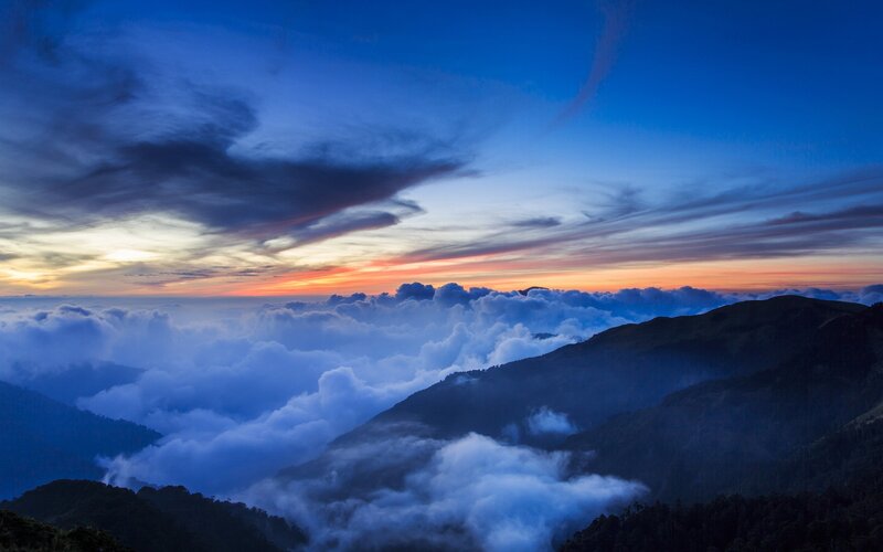 Mountain Peaks Above Clouds — Sky