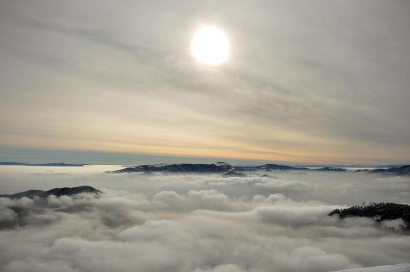 Mountain Peaks Above Clouds — White, Serene, Morning