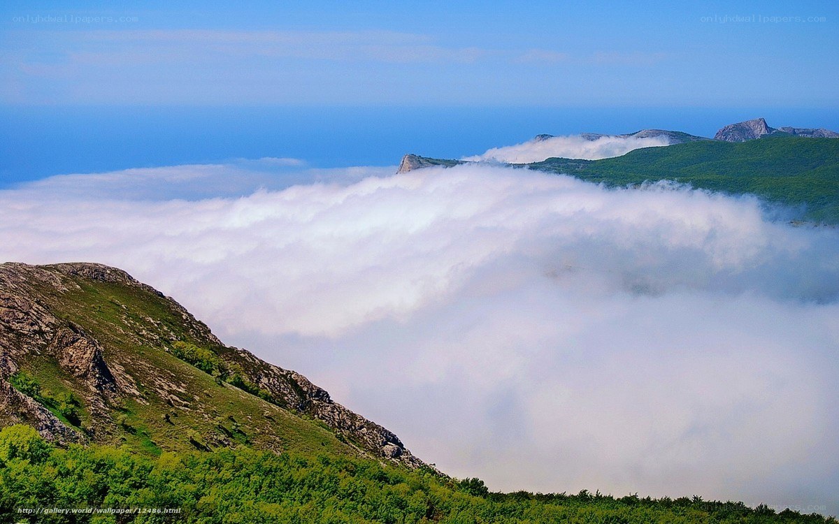 Mountain peaks above clouds