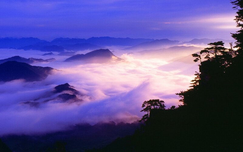 Mountain peaks above sea of clouds