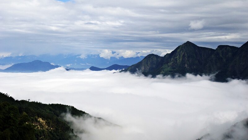 Mountain peaks above sea of clouds