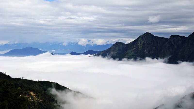 mountain peaks above sea of clouds