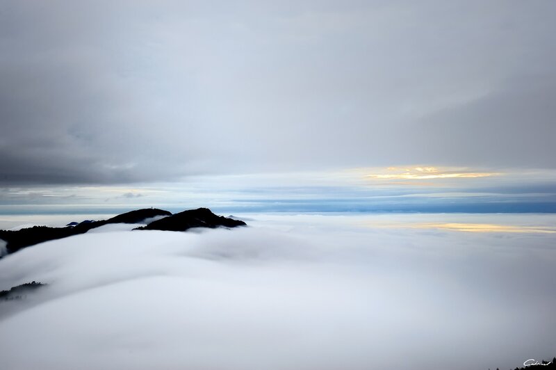 Mountain peaks above sea of clouds
