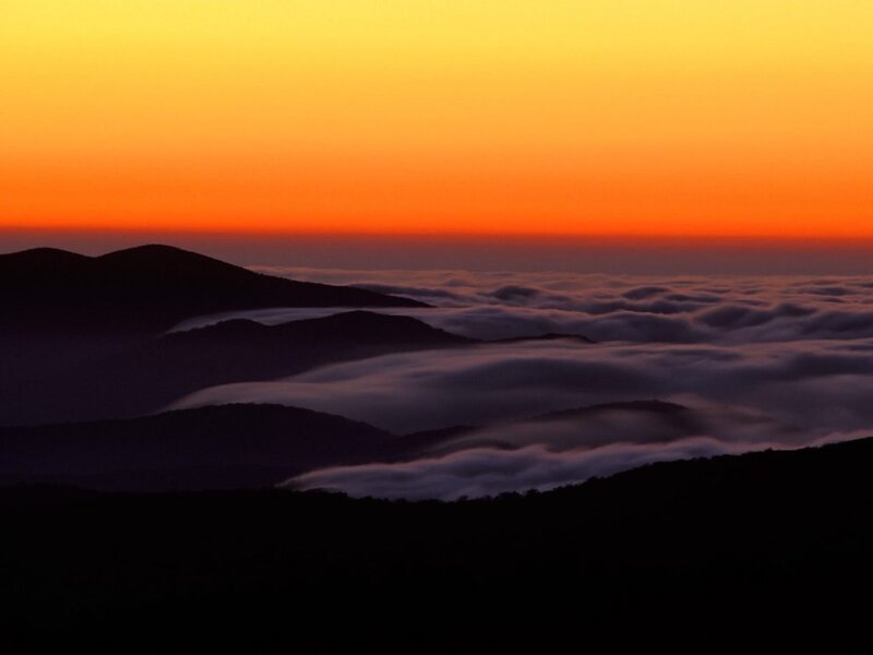 Mountain peaks above sea of clouds