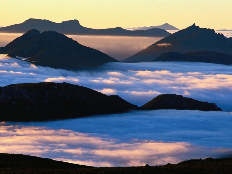 Mountain peaks above sea of clouds