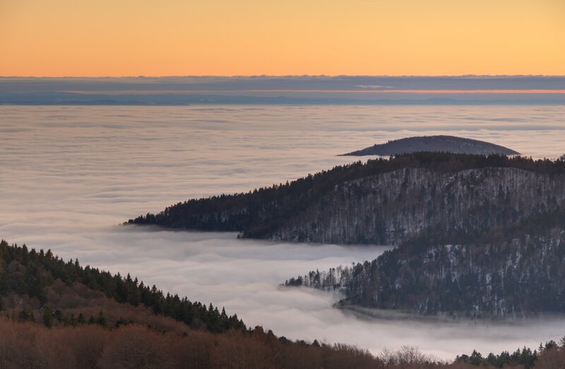 Mountain peaks above sea of clouds