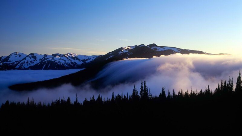Mountain peaks above sea of clouds