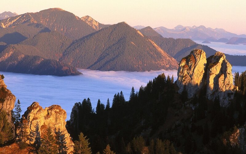 Mountain peaks above sea of clouds