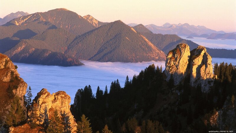 Mountain peaks above sea of clouds