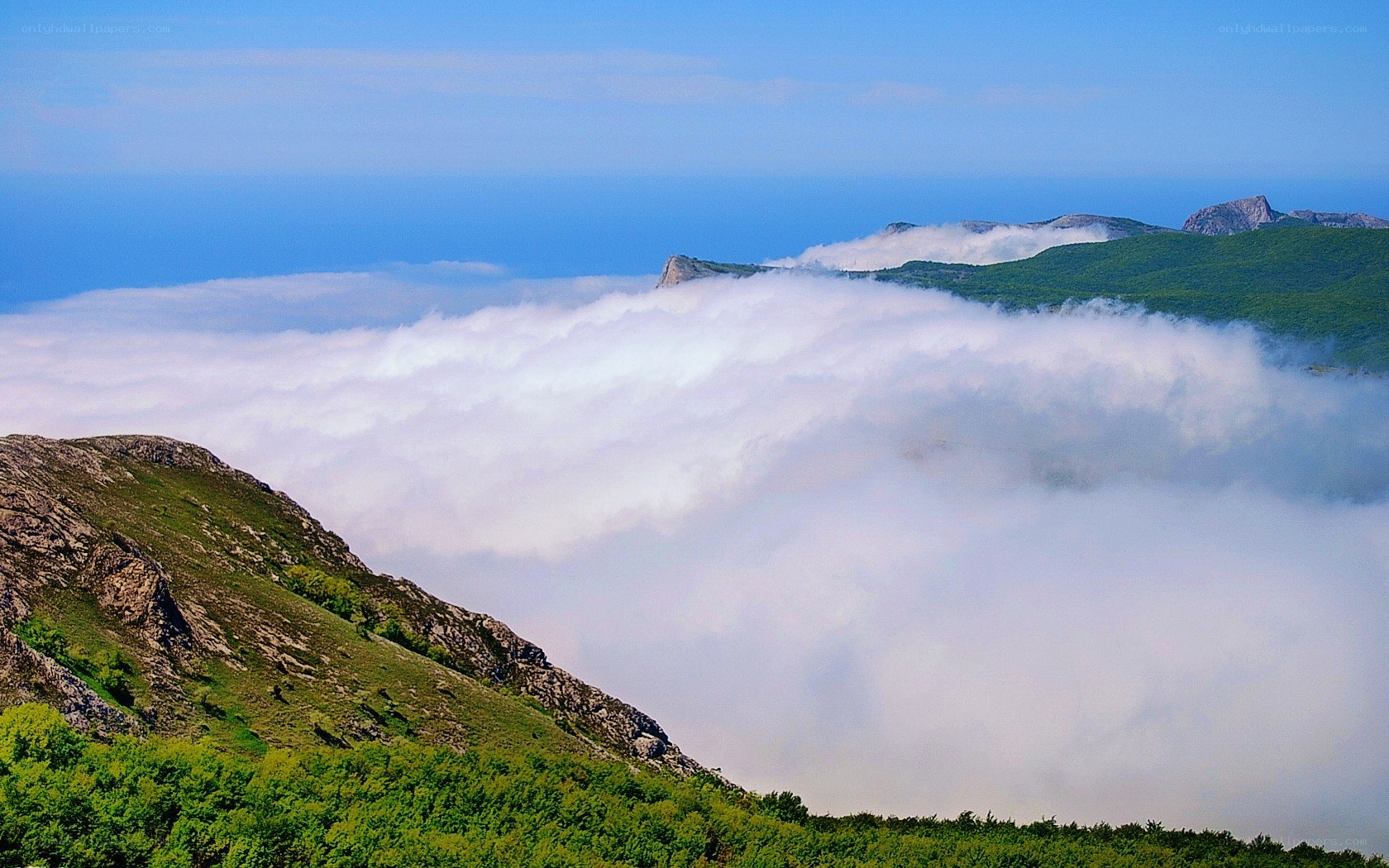 Mountain peaks above the clouds