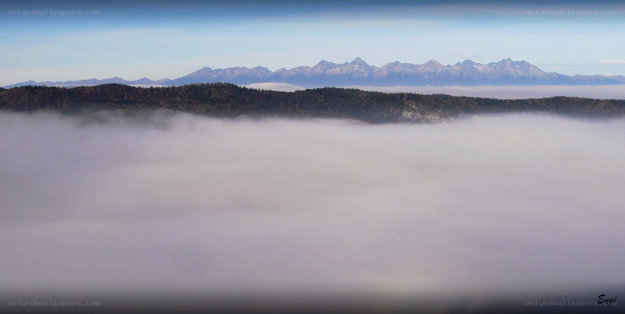 Mountain peaks above the clouds
