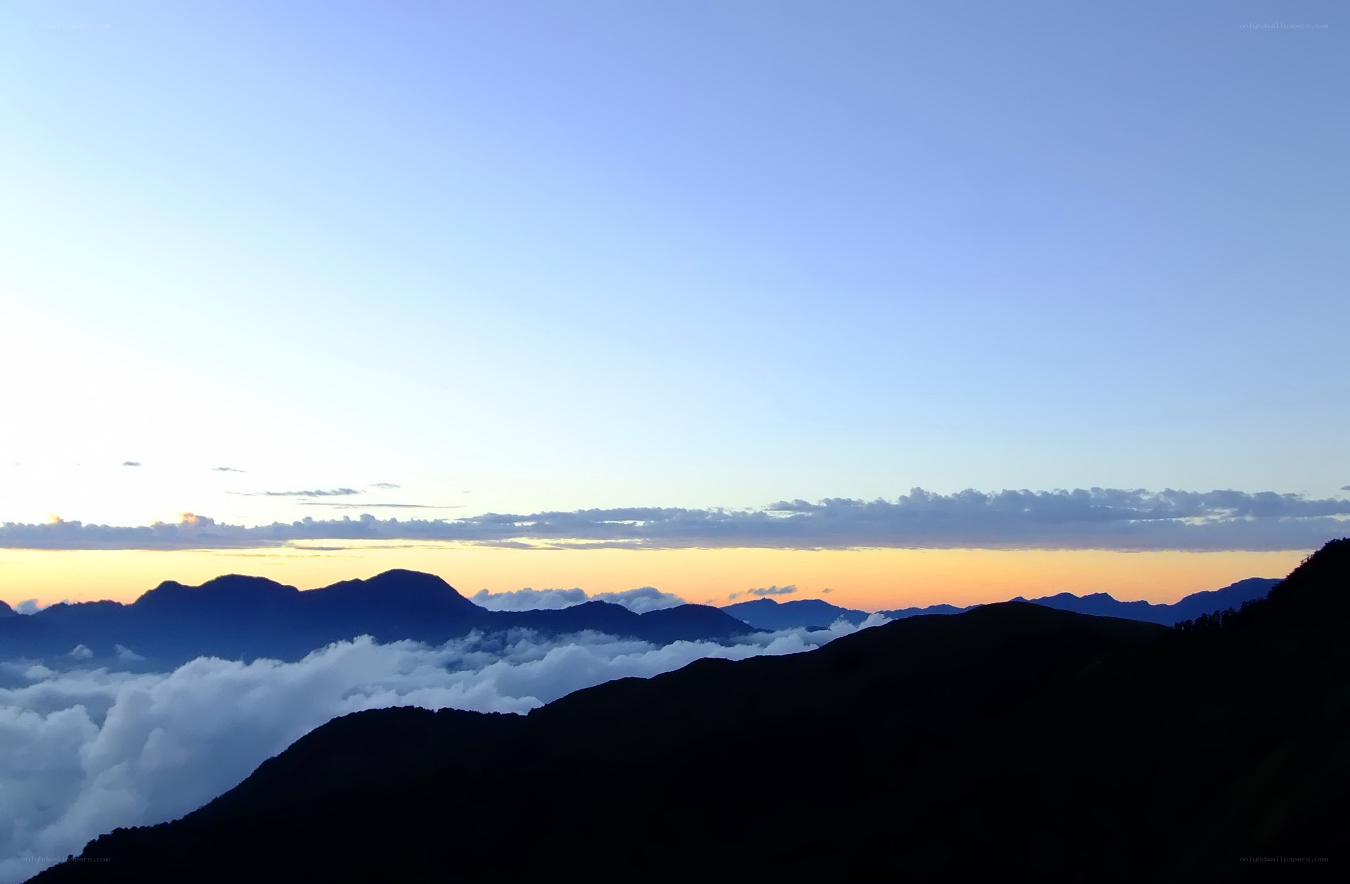 Mountain peaks above the clouds
