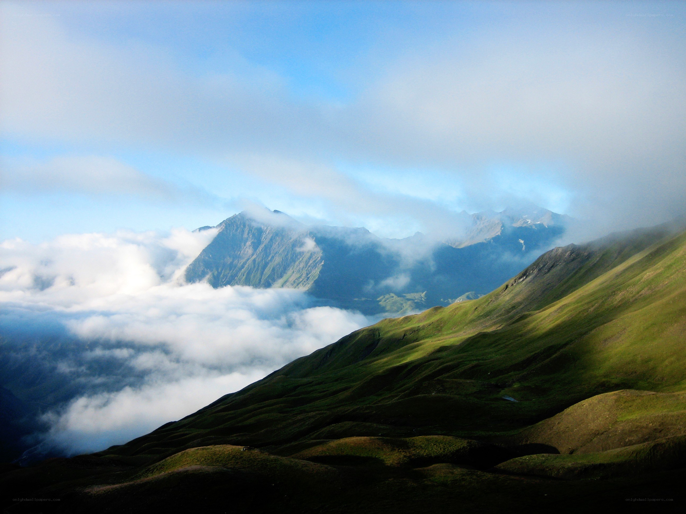 Mountain peaks above the clouds
