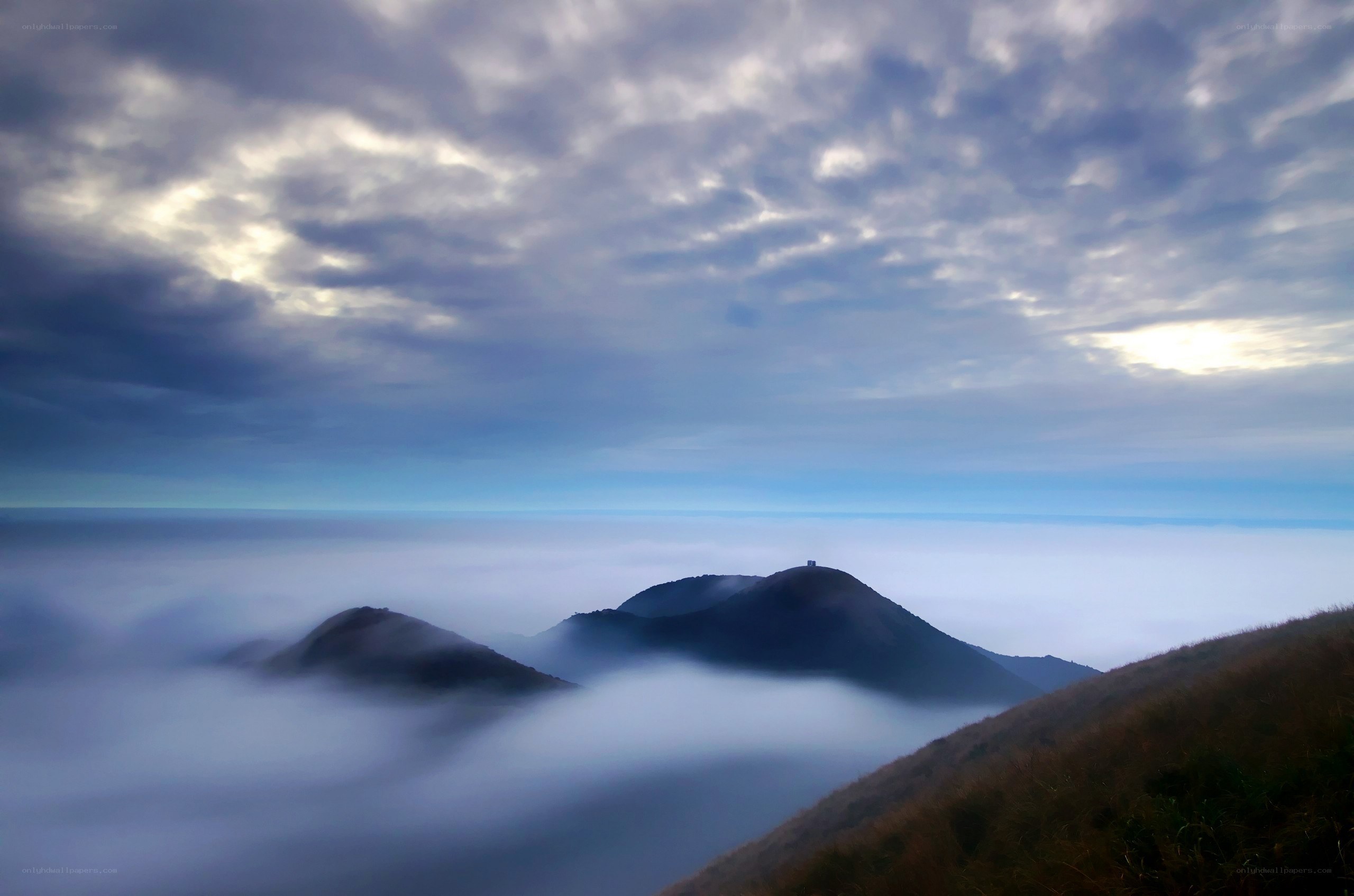 Mountain peaks above the clouds