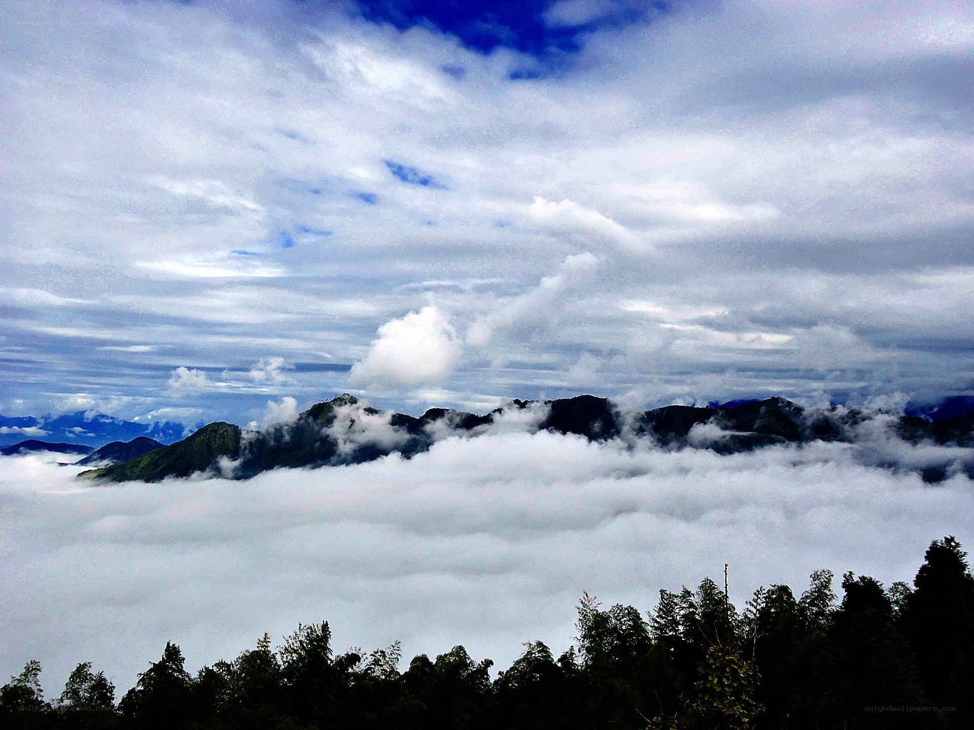Mountain peaks above the clouds