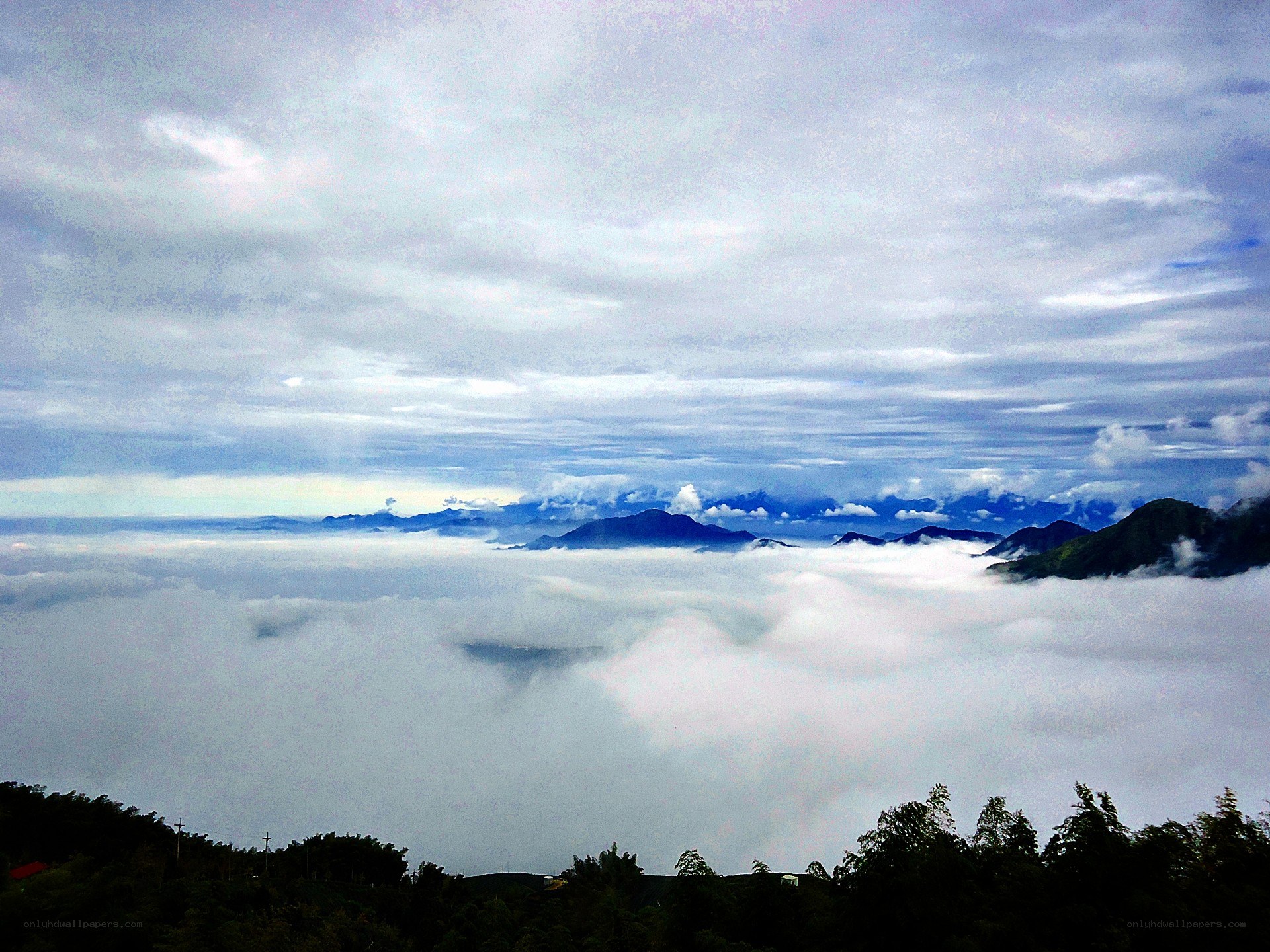 mountain peaks above the clouds