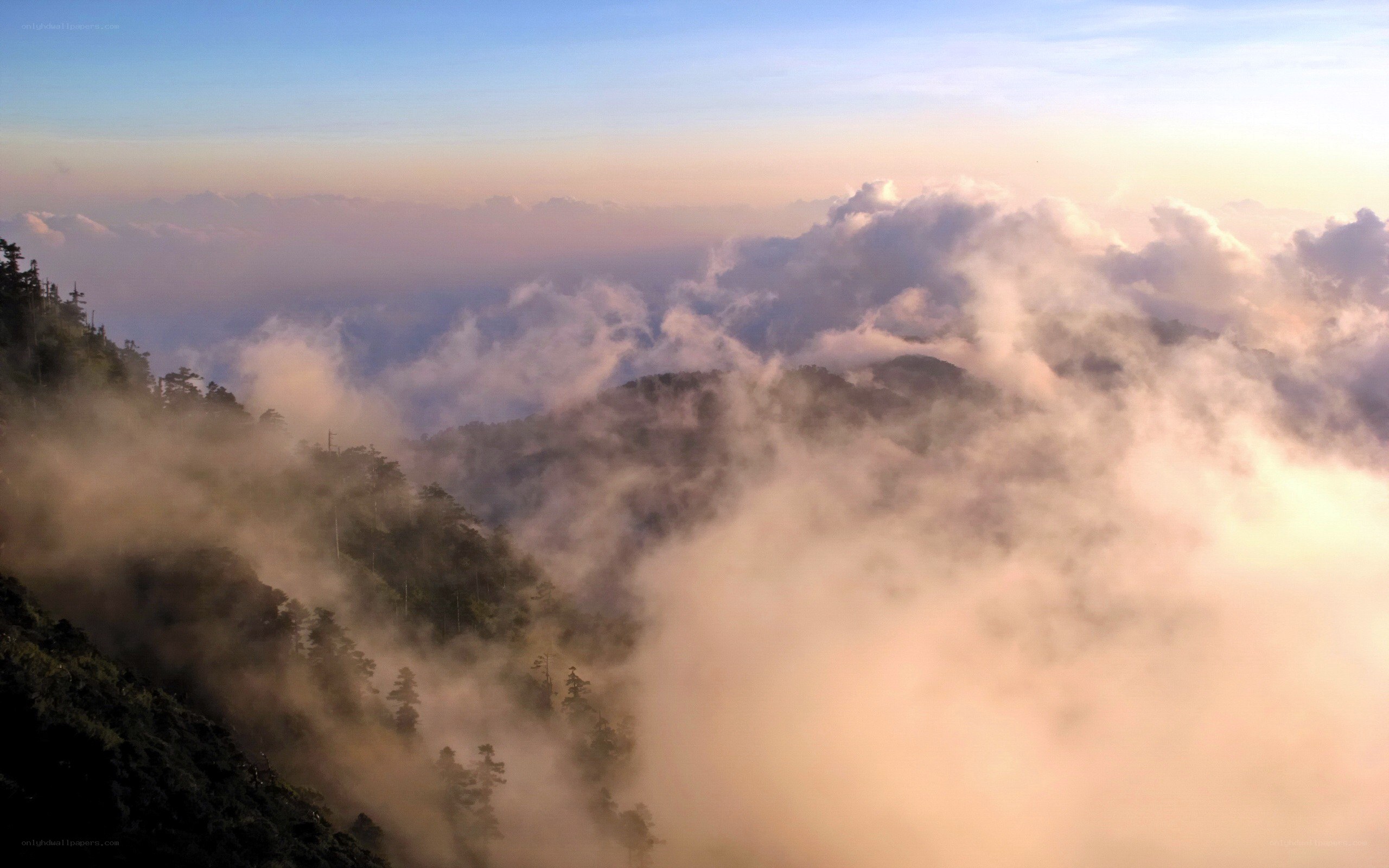 mountain peaks above the clouds