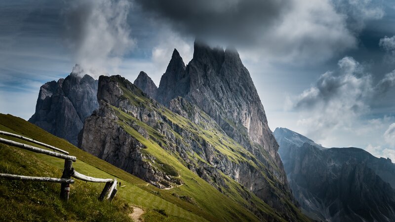 Mountain Peaks and Grassy Slope
