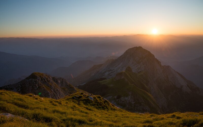 Mountain Peaks at Sunrise — Orange, Serene