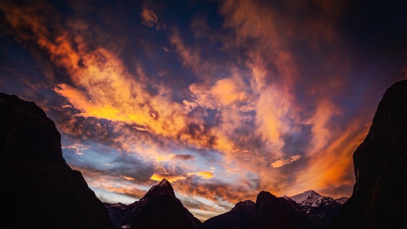 Mountain Peaks at Sunset — Orange, Dramatic, Photograph, Clouds