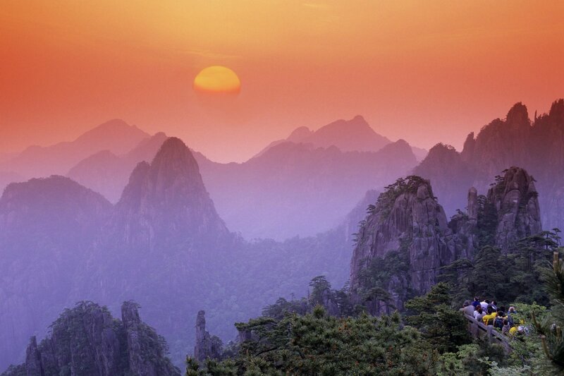 Mountain Peaks at Sunset — Orange, Serene, Photograph, Sun, Trees, People