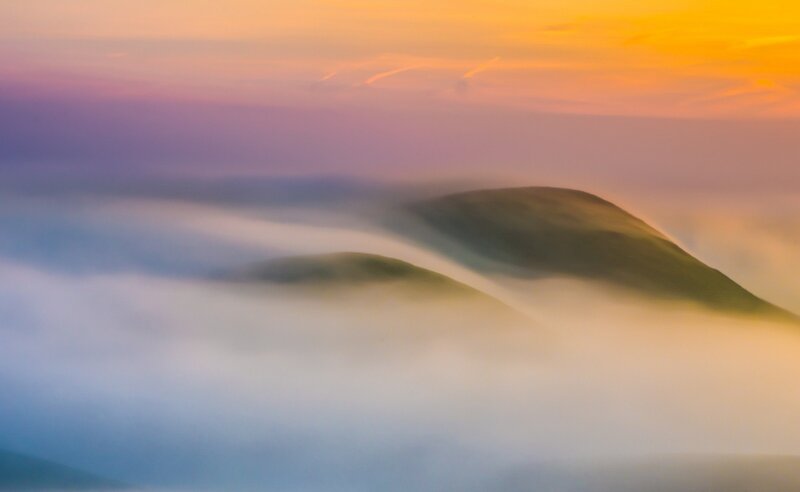Mountain Peaks in Fog — Orange
