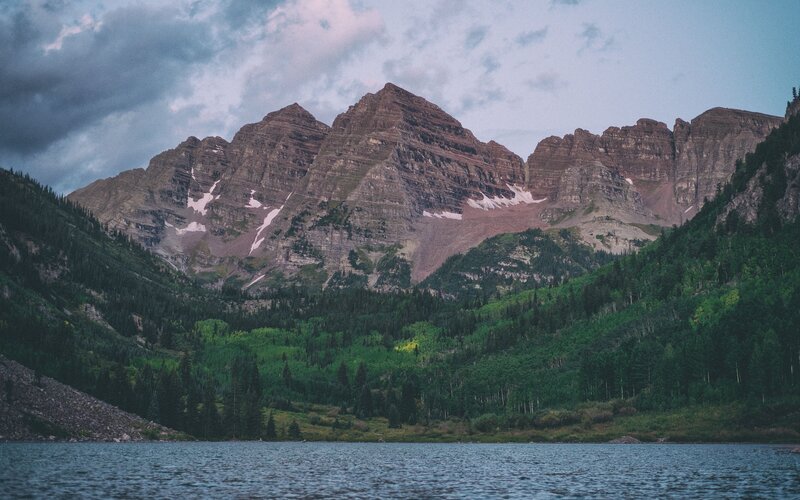 mountain peaks over a lake