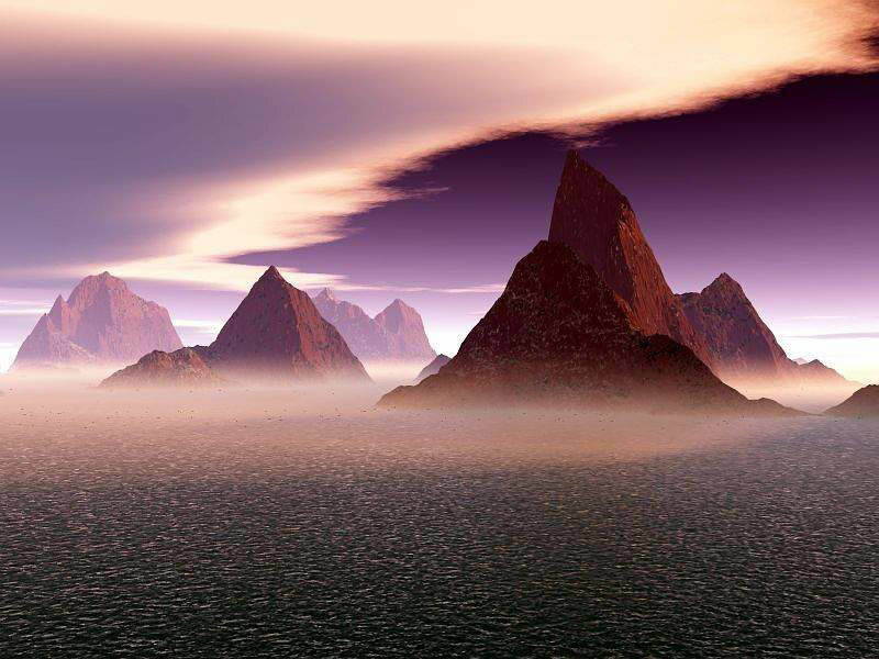 mountain peaks over misty sea