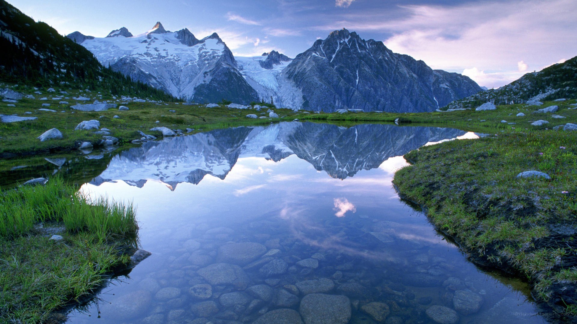 Mountain peaks reflected in a calm lake