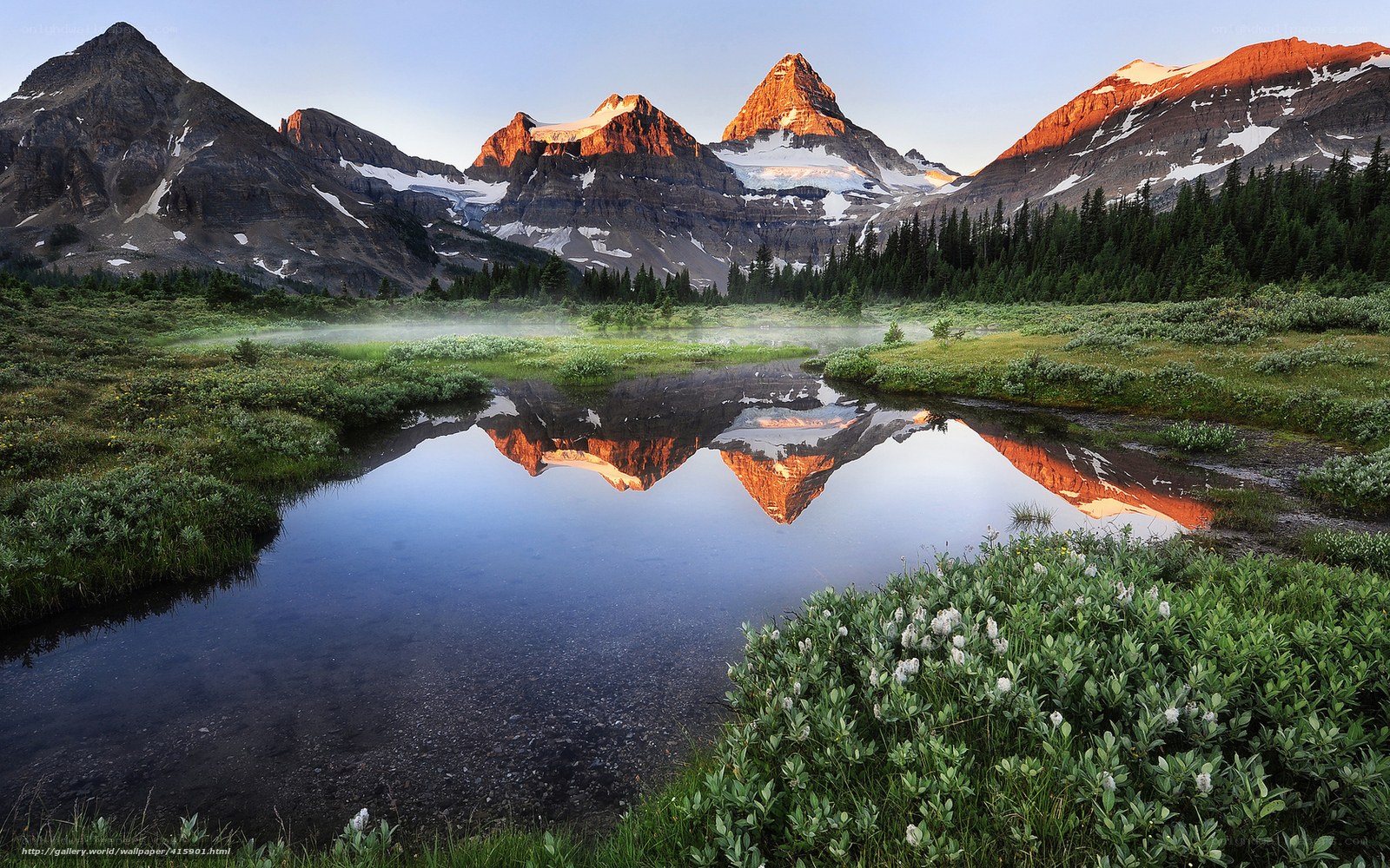 Mountain peaks reflected in a calm lake