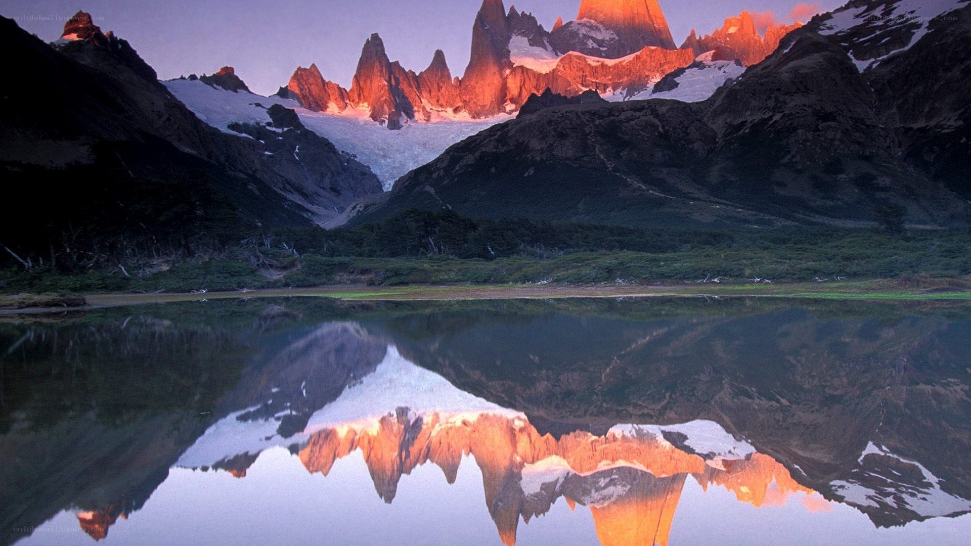 mountain peaks reflected in a lake