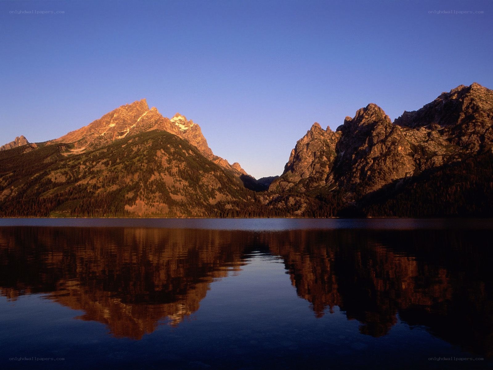 mountain peaks reflected in a lake