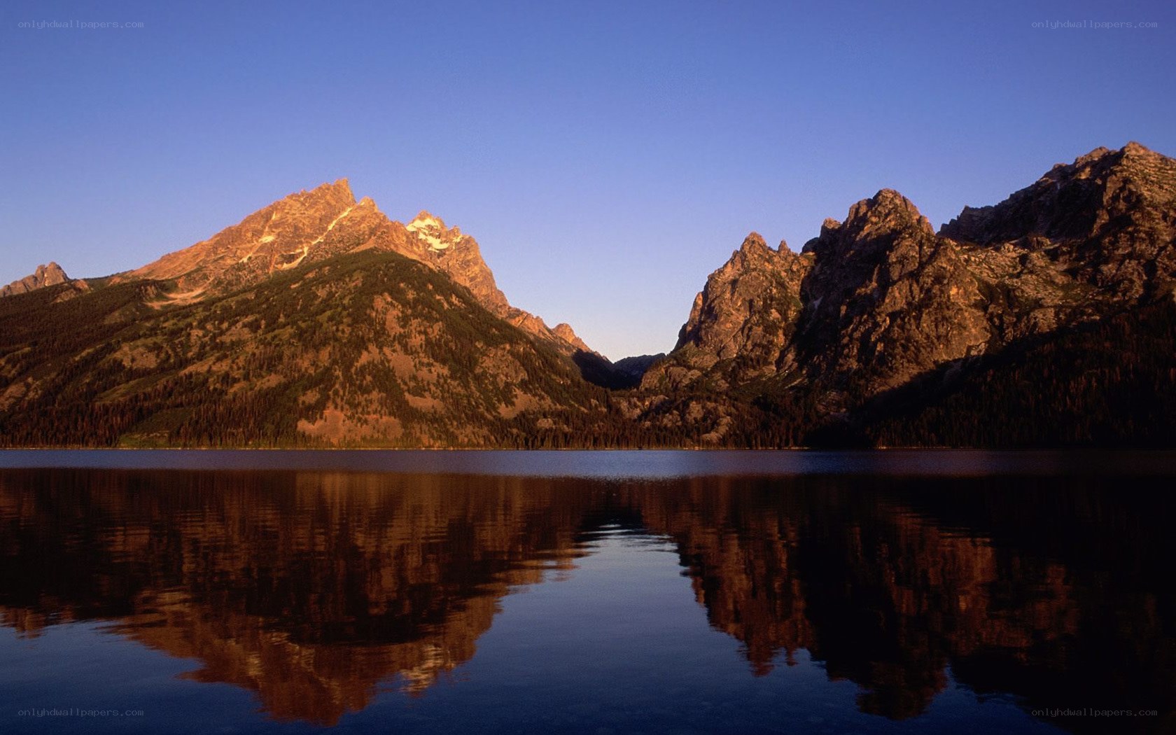 mountain peaks reflected in a lake