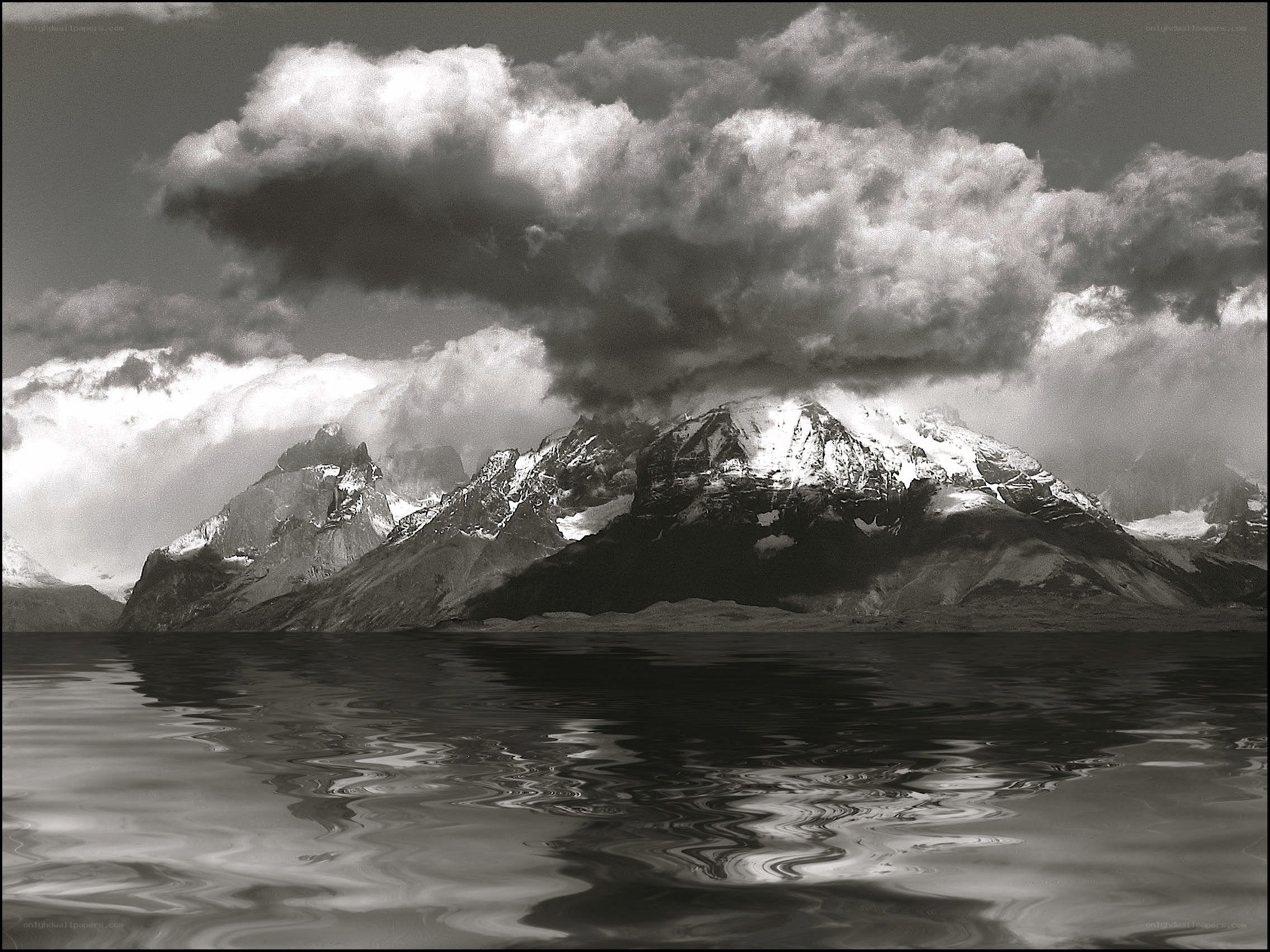 Mountain peaks reflected in water