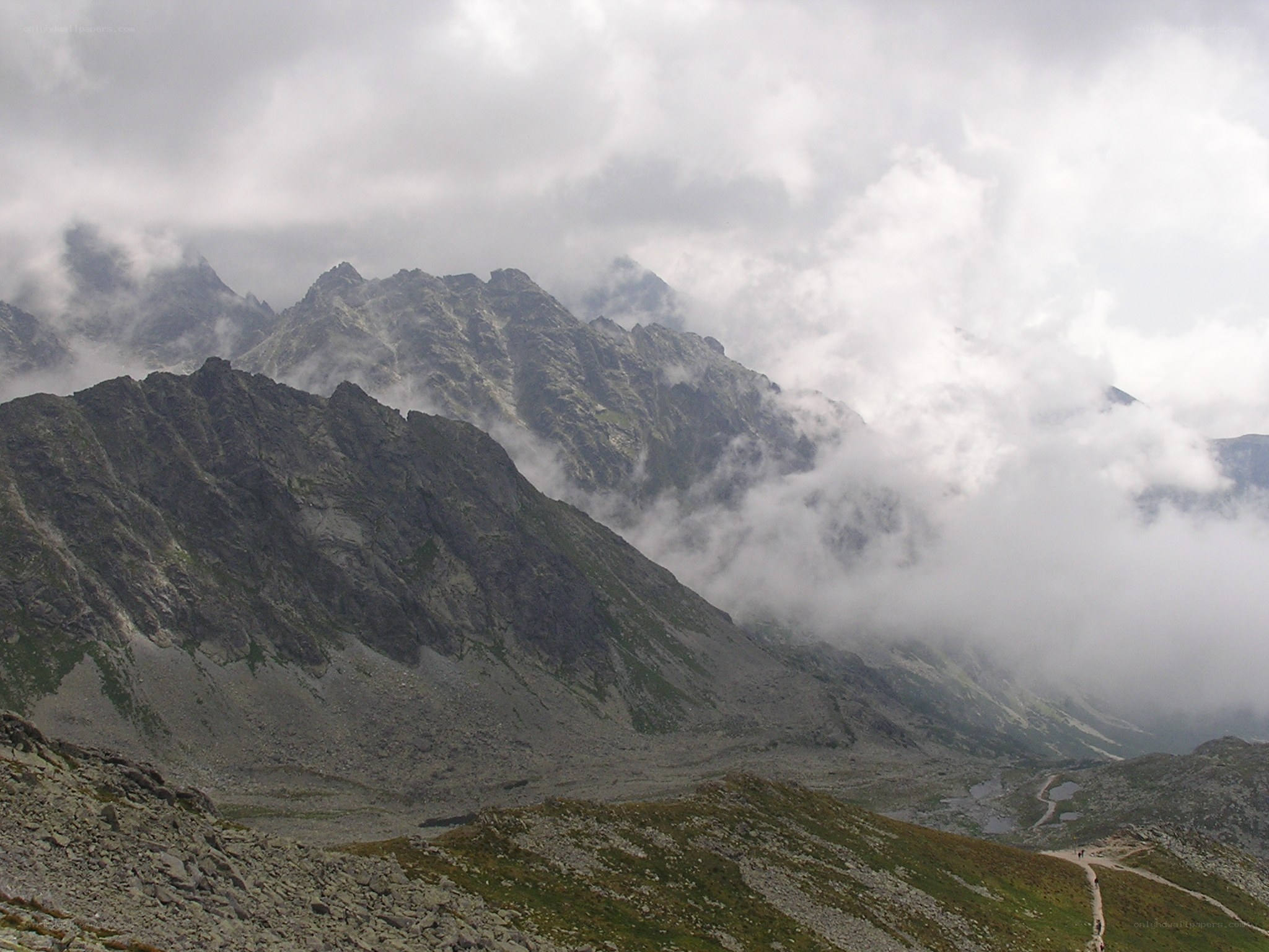 Mountain peaks shrouded in clouds
