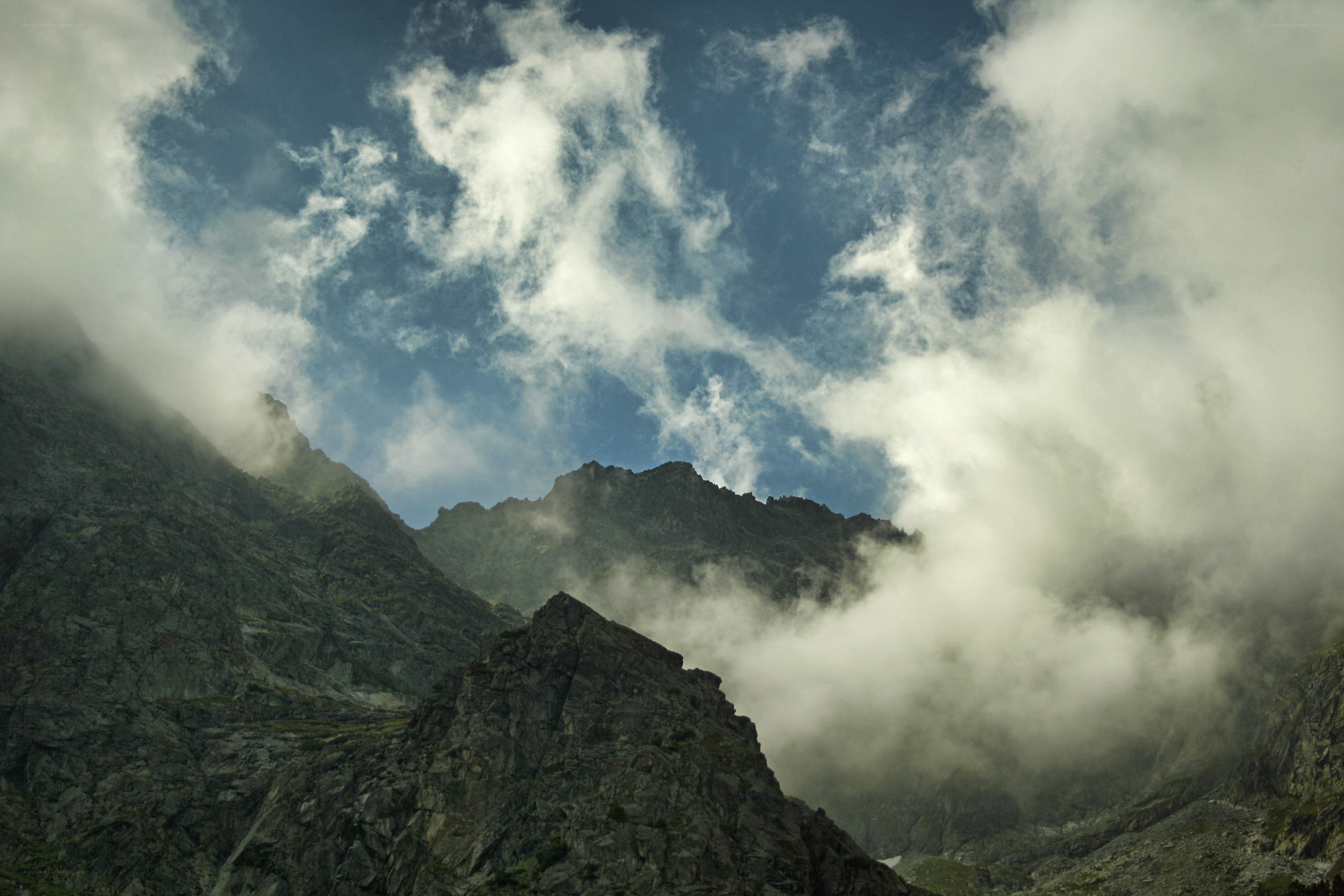 Mountain peaks shrouded in clouds