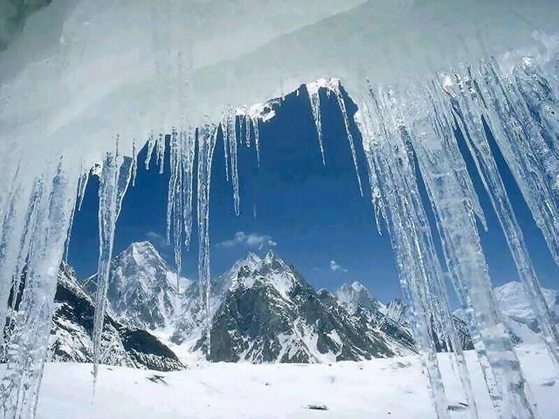 Mountain Peaks Through Ice