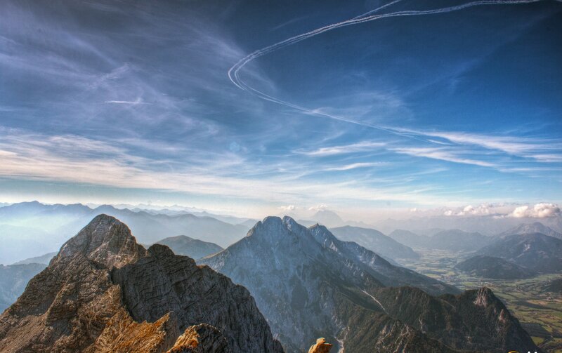 Mountain peaks under a blue sky