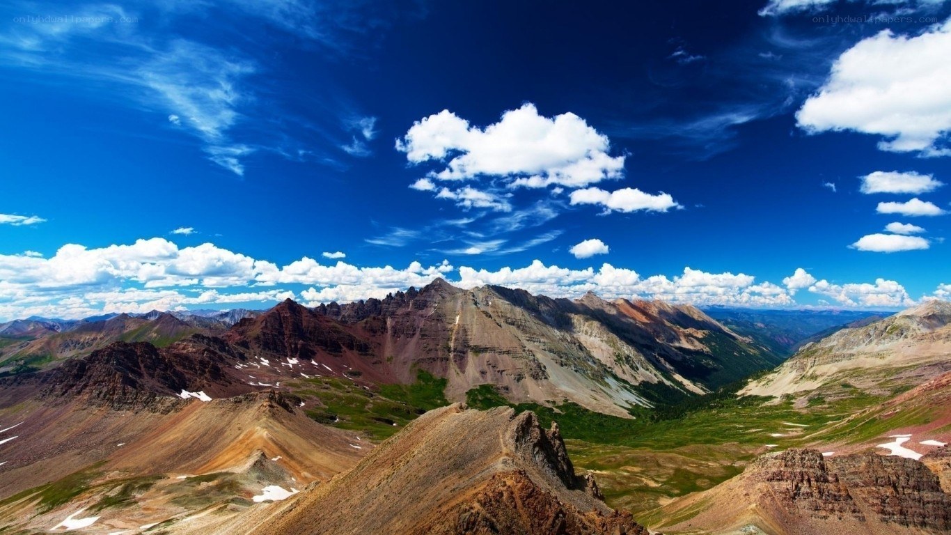 Mountain peaks under blue sky