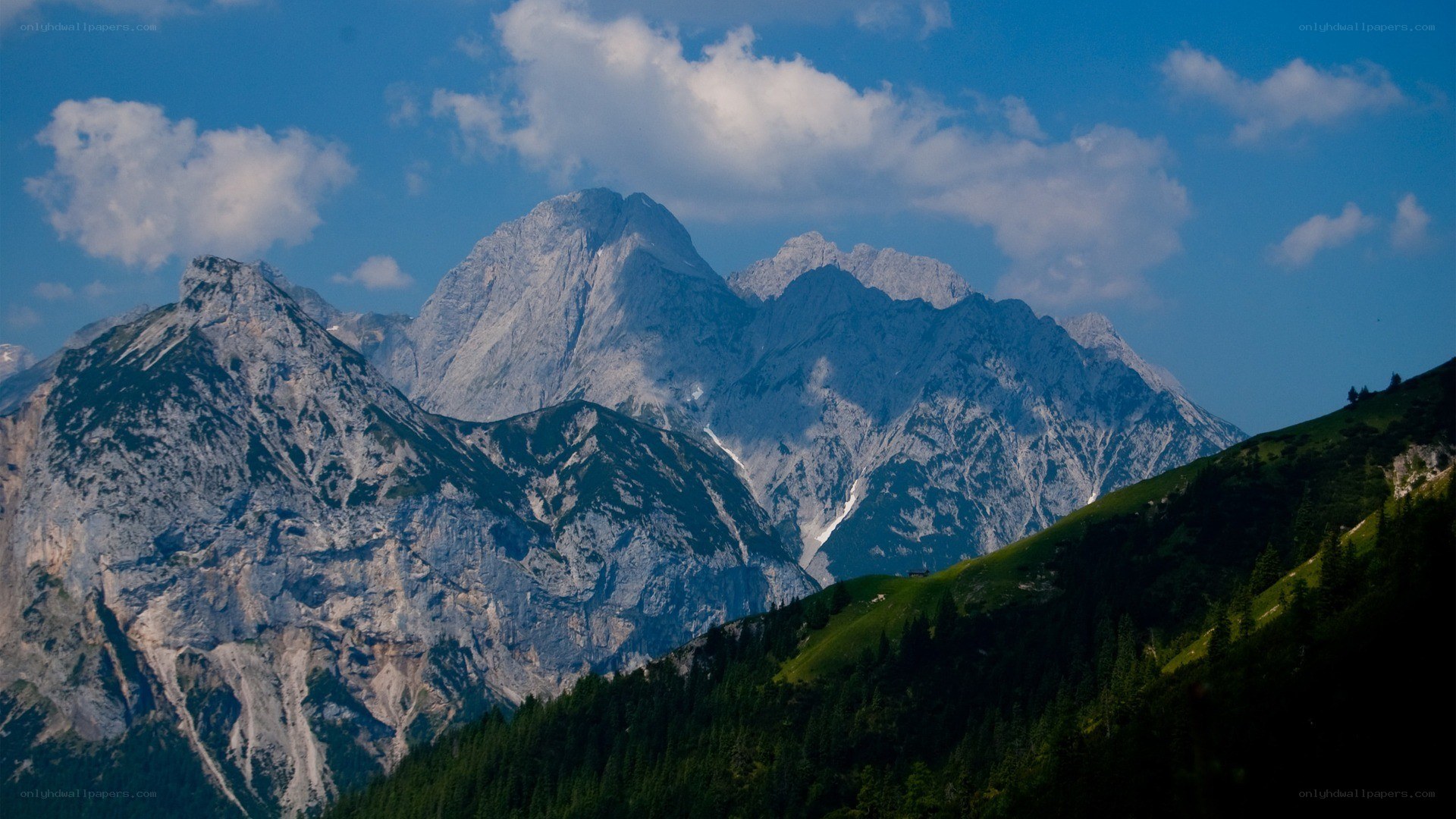 Mountain peaks under blue sky