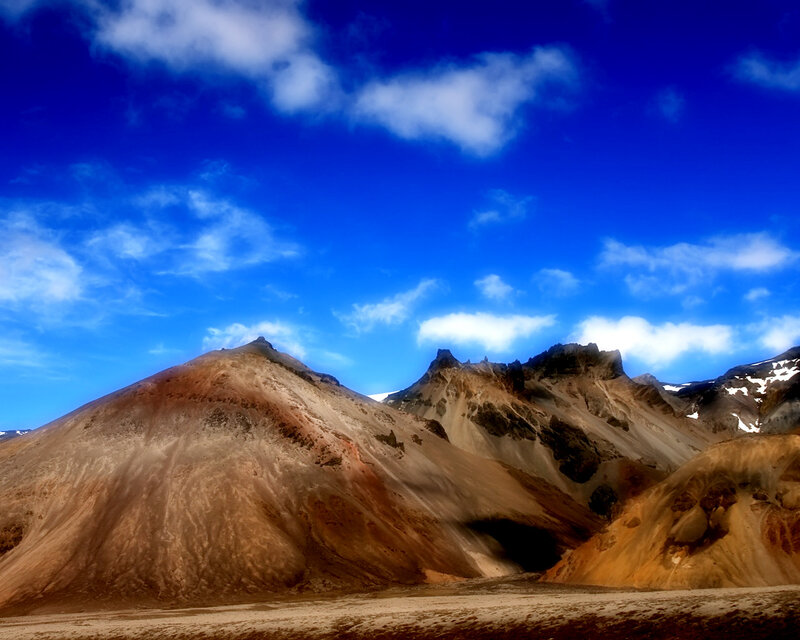 Mountain peaks under blue sky