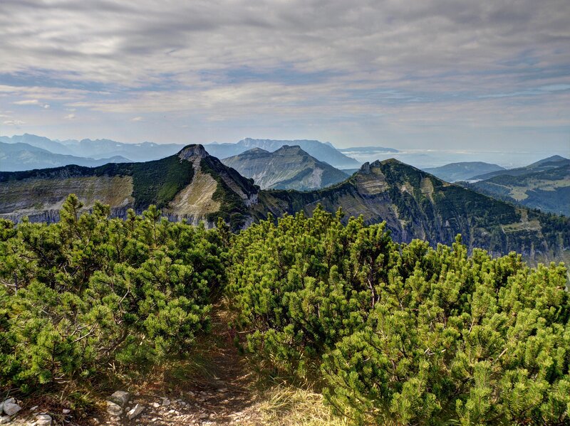Mountain peaks under cloudy sky