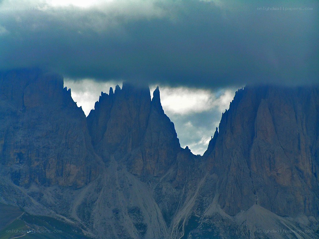 Mountain peaks under storm clouds