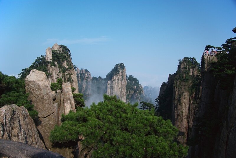 Mountain peaks with pine trees