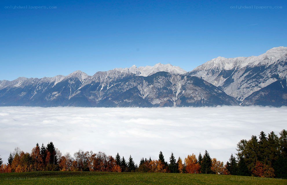 mountain range above clouds