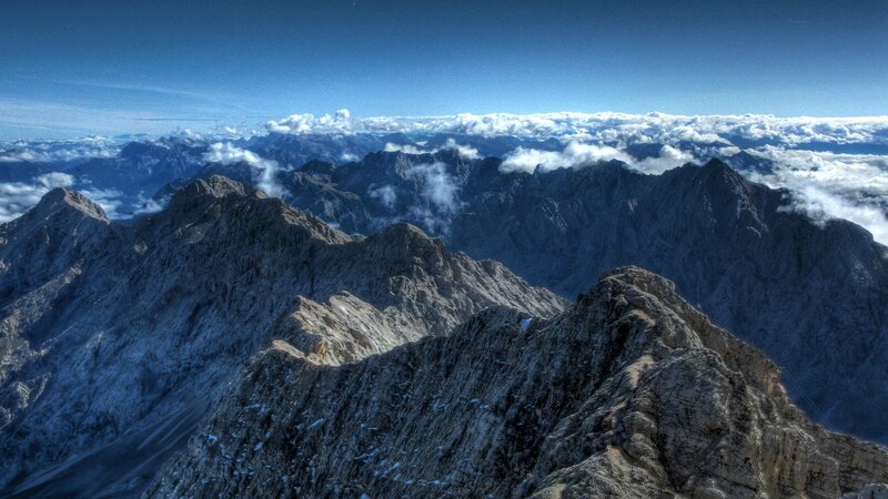 Mountain Range Above Clouds — Blue, Dramatic